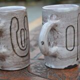 2 ceramic mugs signed db