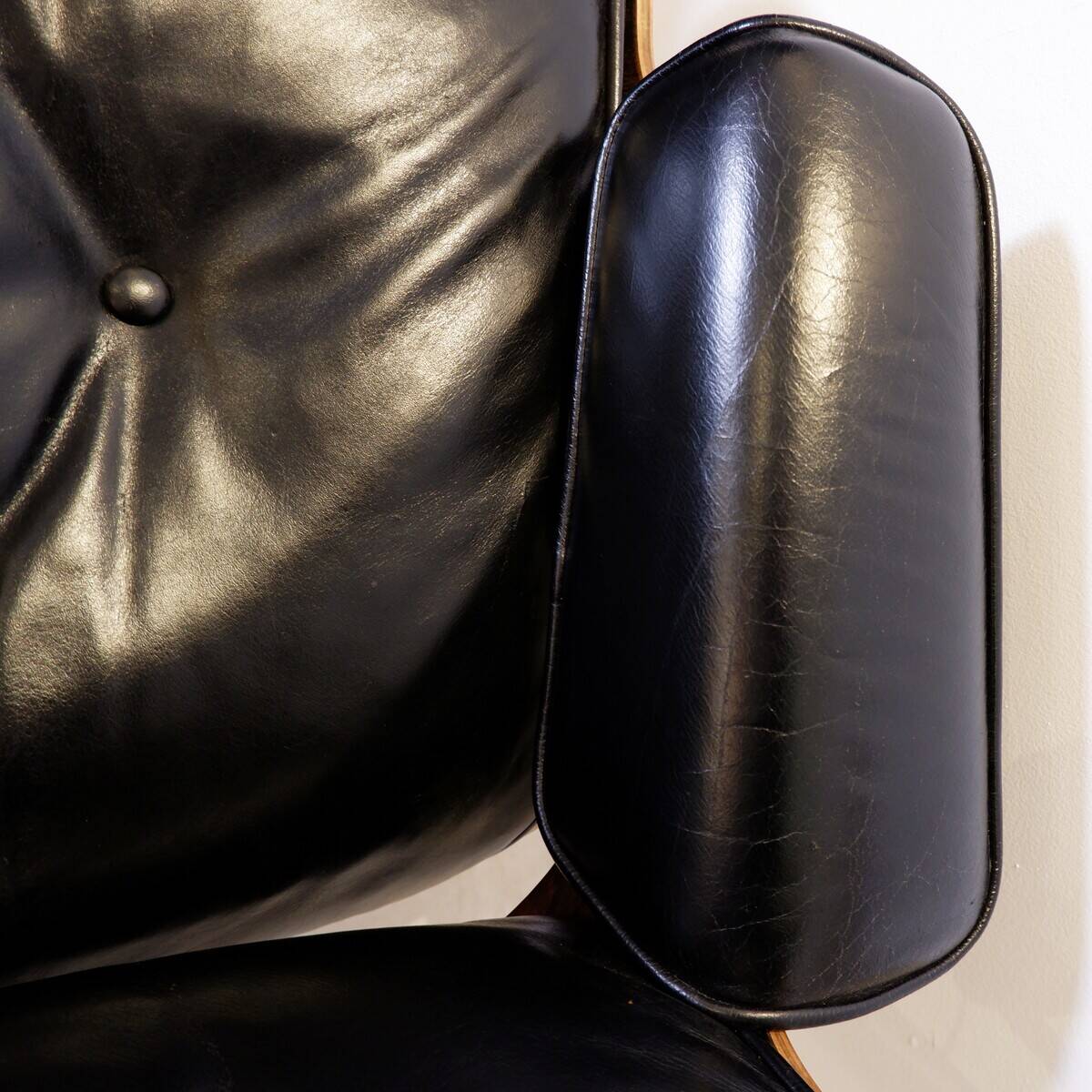 Mid-Century armchair and footrest by Charles & Ray Eames for Herman Miller