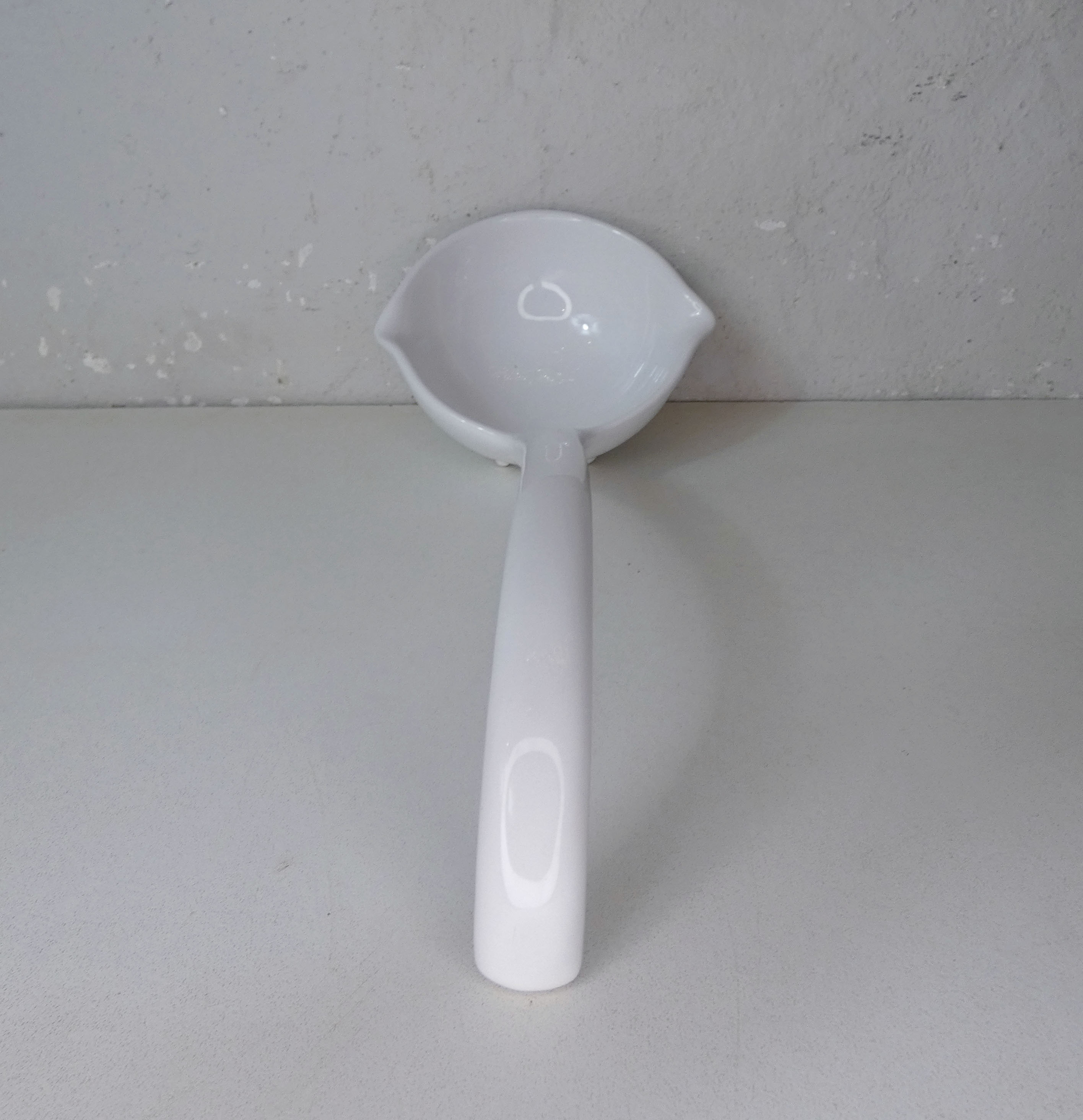 White ceramic ladle