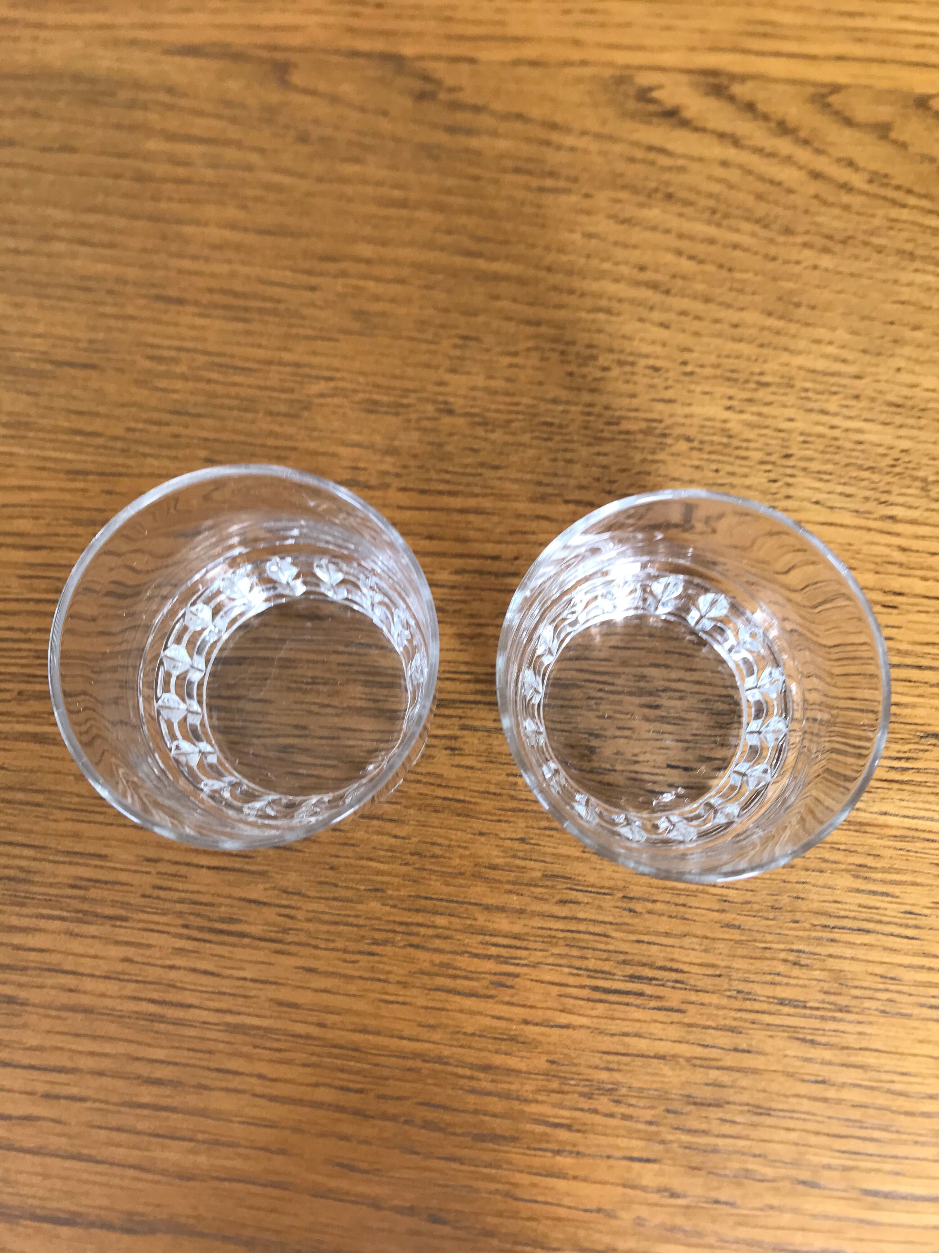 Mismatched decanter and whiskey glasses
