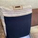 Exotic 2-seater sofa in woven banana tree / rattan and brown fabric.