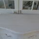 Curved patinated chest of drawers pearl grey waxed finish