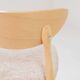 Set of 6 pale pink dining chairs in natural wood.