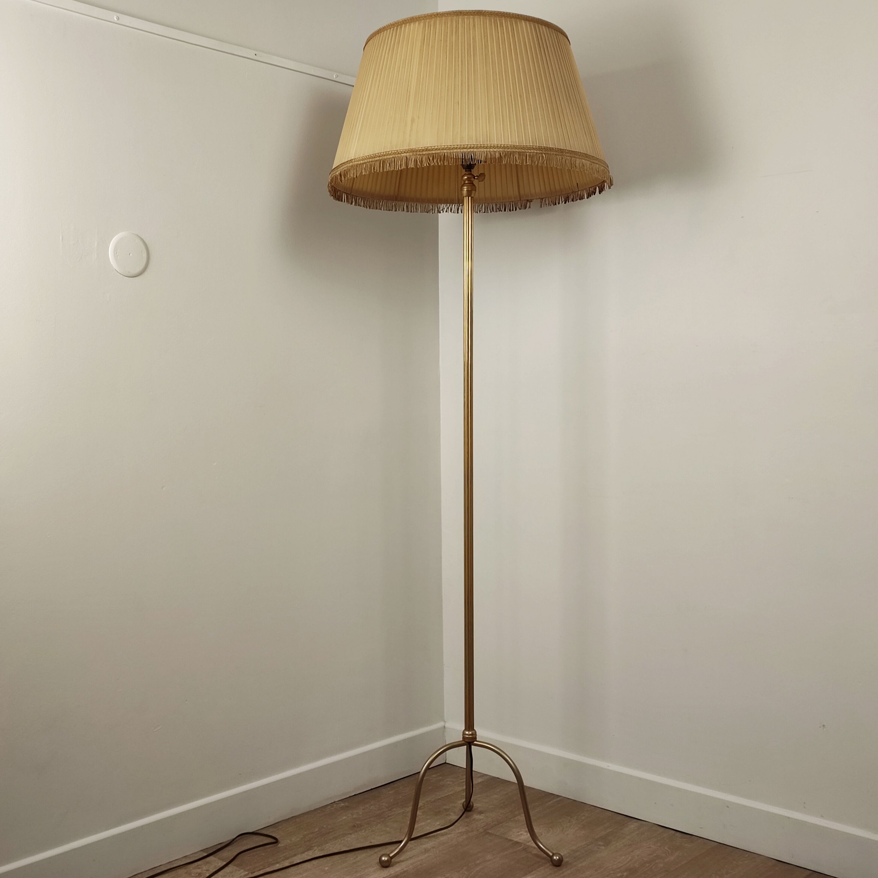 Golden tripod floor lamp