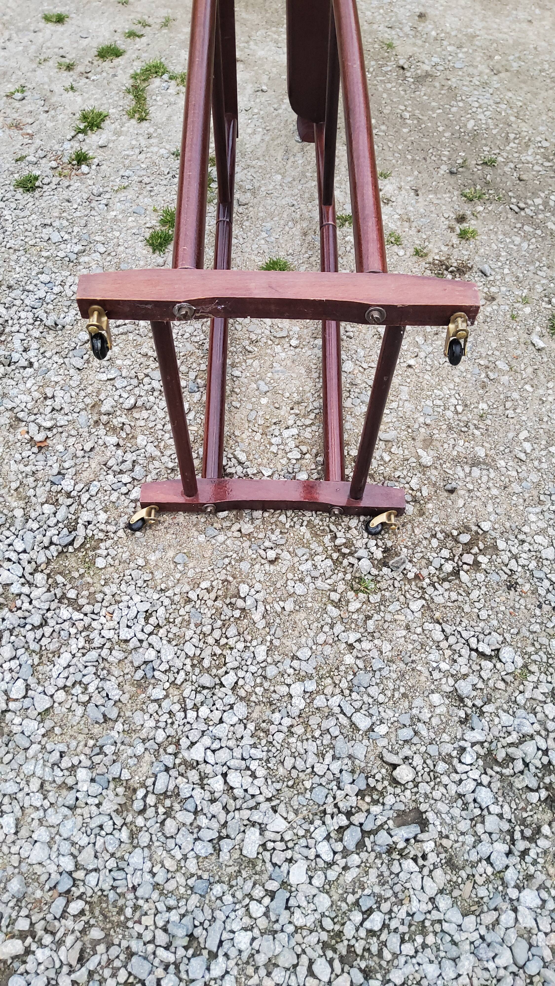 Chamber valet in mahogany tinted beech from the 70s with castors