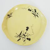 A yellow Art Deco ceramic tobacco service decorated with thistles from the 1920s to 1930s.