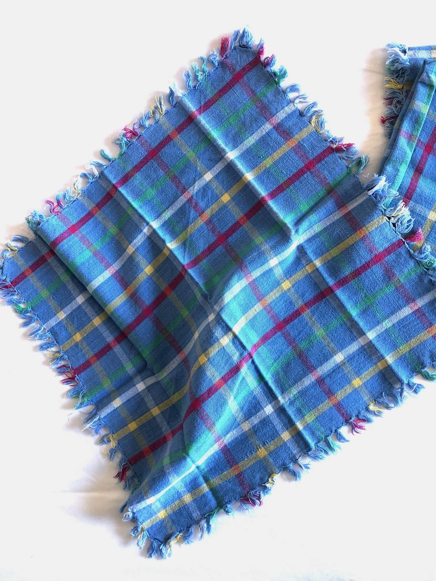 Vintage tablecloth & napkins, blue with multicoloured stripes.