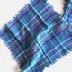 Vintage tablecloth & napkins, blue with multicoloured stripes.
