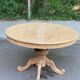 Extendable round dining table with central art deco leg, renovated in raw wood