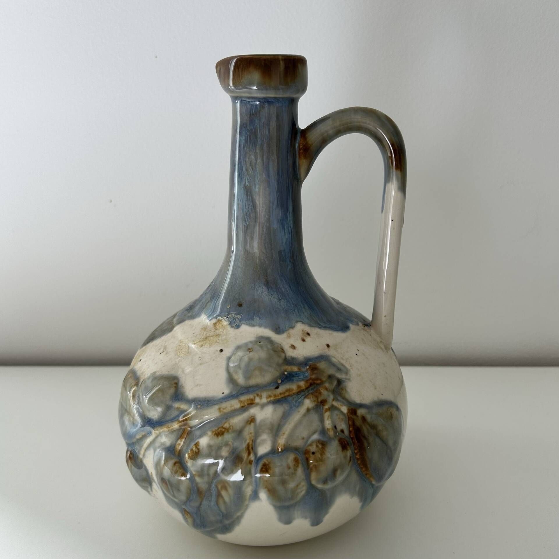 Cherry-decorated earthenware carafe