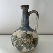 Cherry-decorated earthenware carafe
