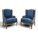 Pair of Louis XV style wingback armchairs in blue velvet.