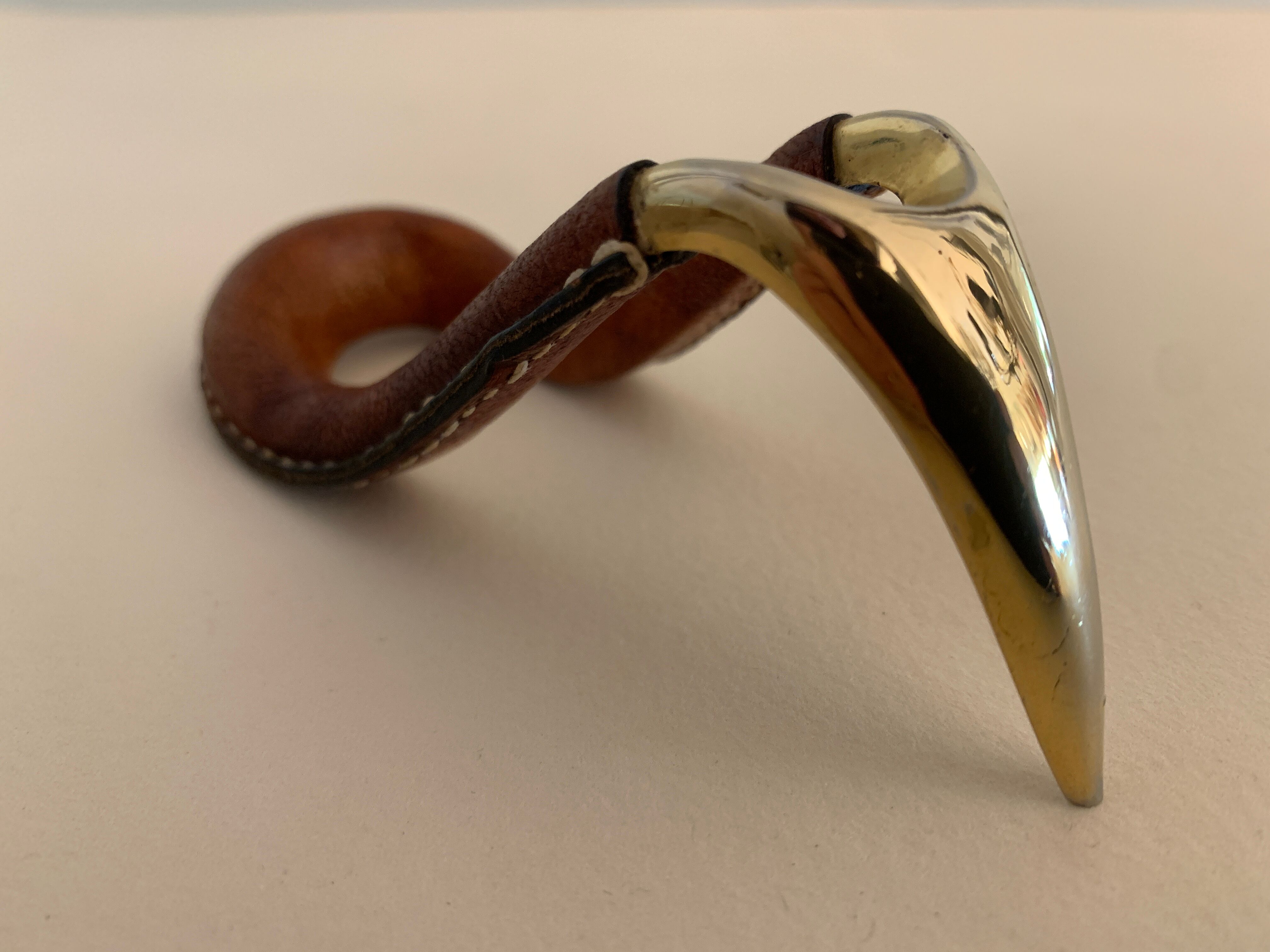 Carl Auböck pipe rack in leather and bronze, 1963