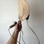 Woven rattan wall light in the style of Igno Maurer, design from the 1970s.