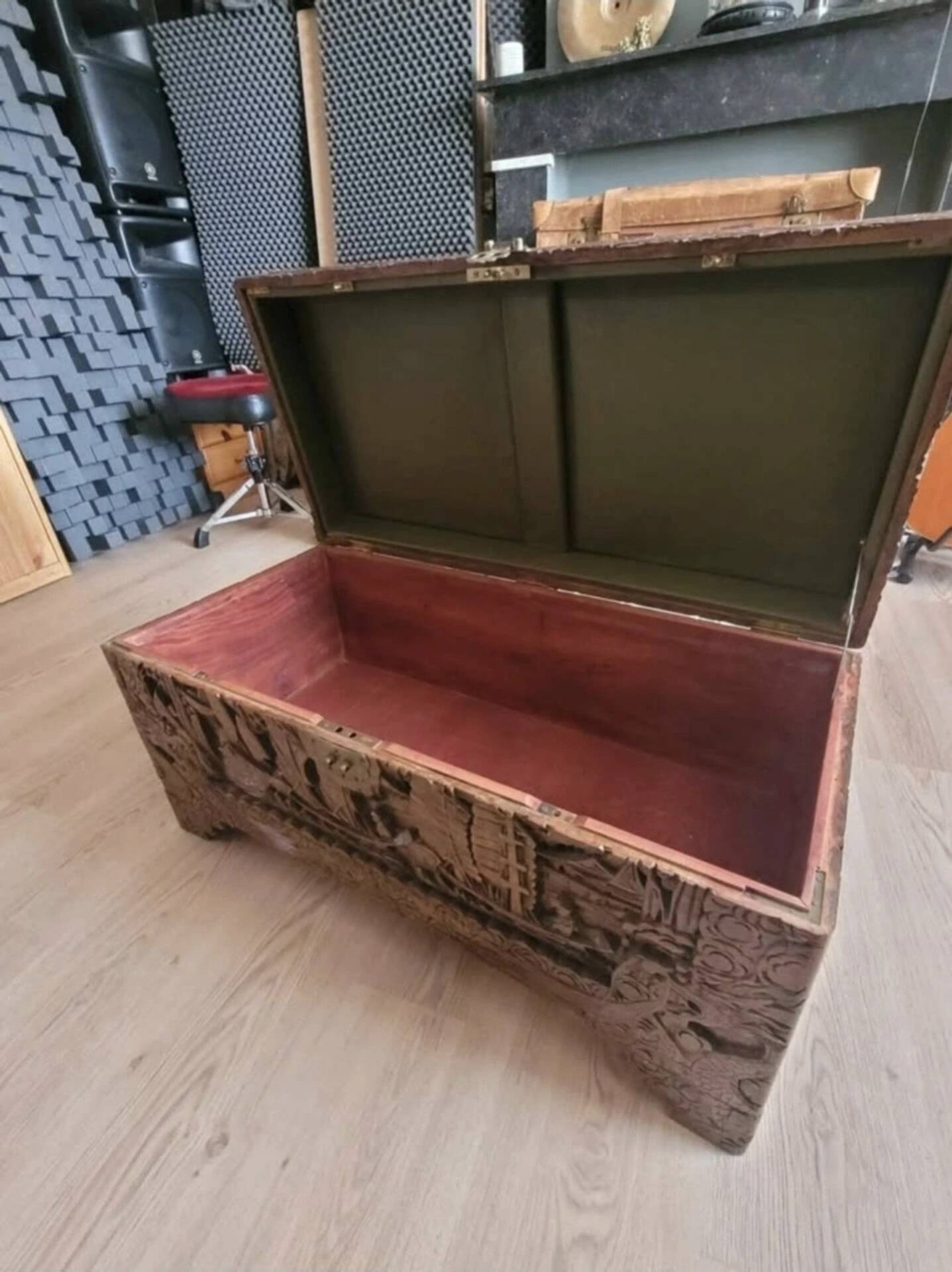 Carved chest in Asian camphor wood, chinoiserie boat decoration.