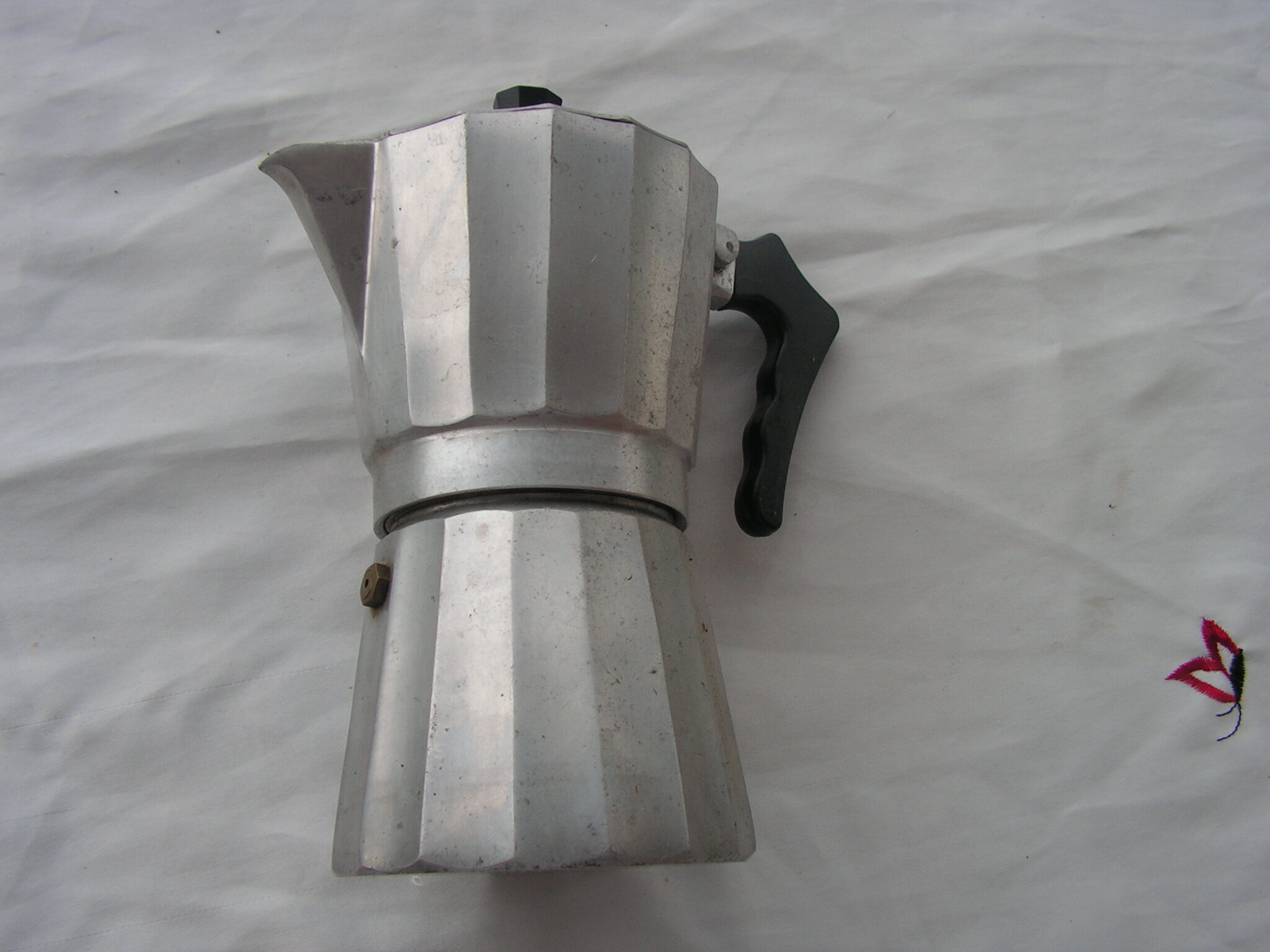 Italian coffee maker in aluminum grip in bakelite