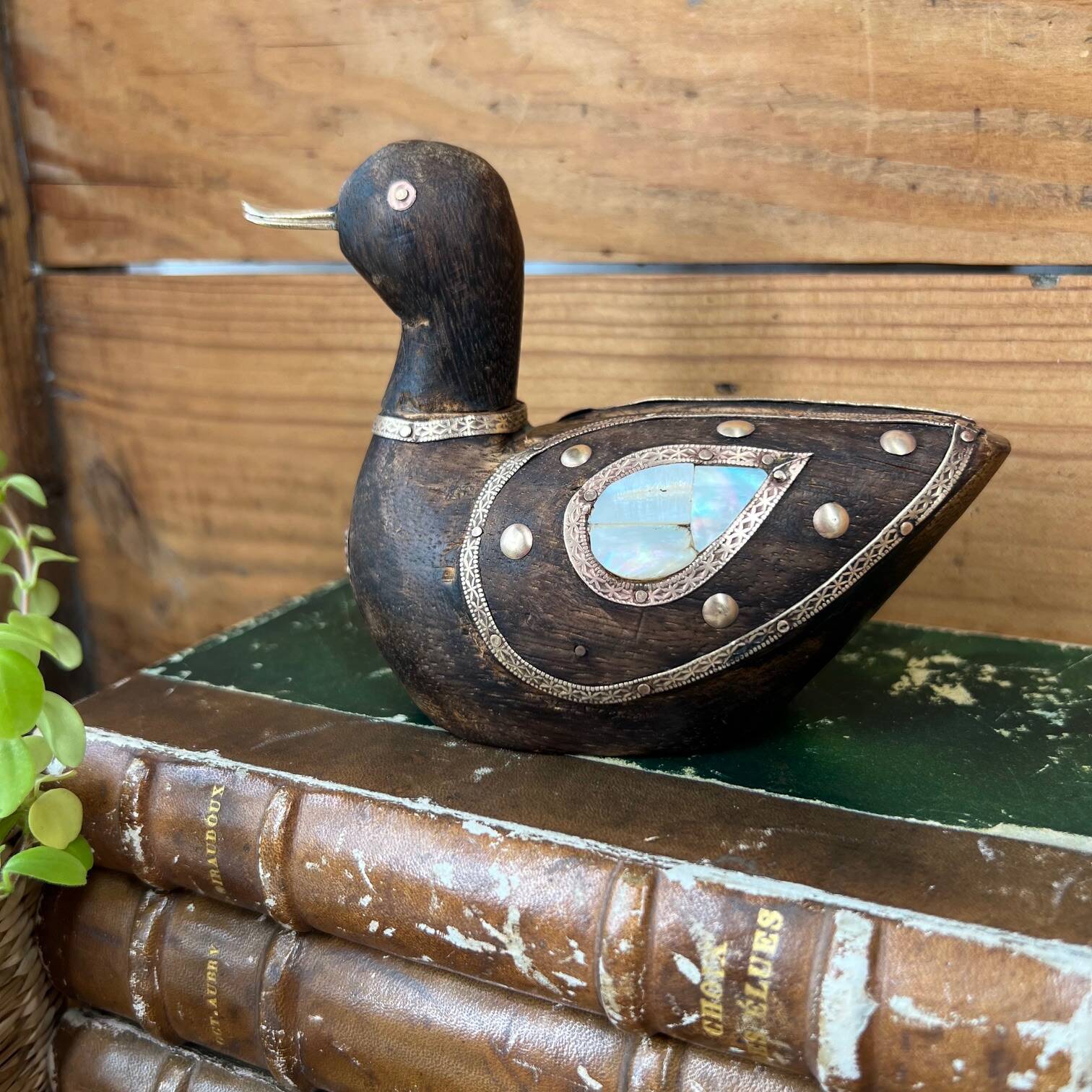 Bird in dark wood, brass & mother-of-pearl