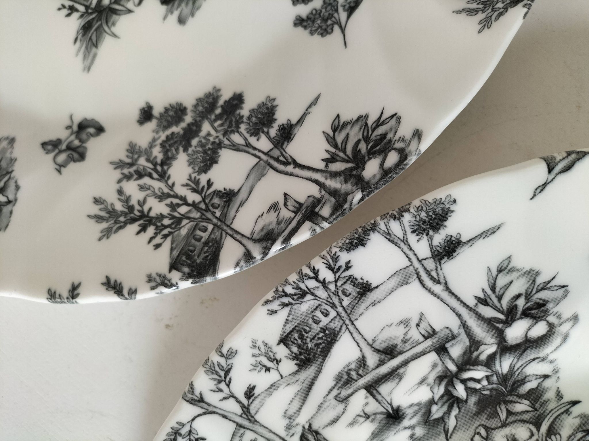 Set of black and white plates in the style of toile de Jouy.