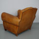 Vintage french moustache back cognac-colored leather club chair
