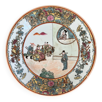 Beautiful Chinese enameled porcelain dish with traditional decoration of Chinese women with servants