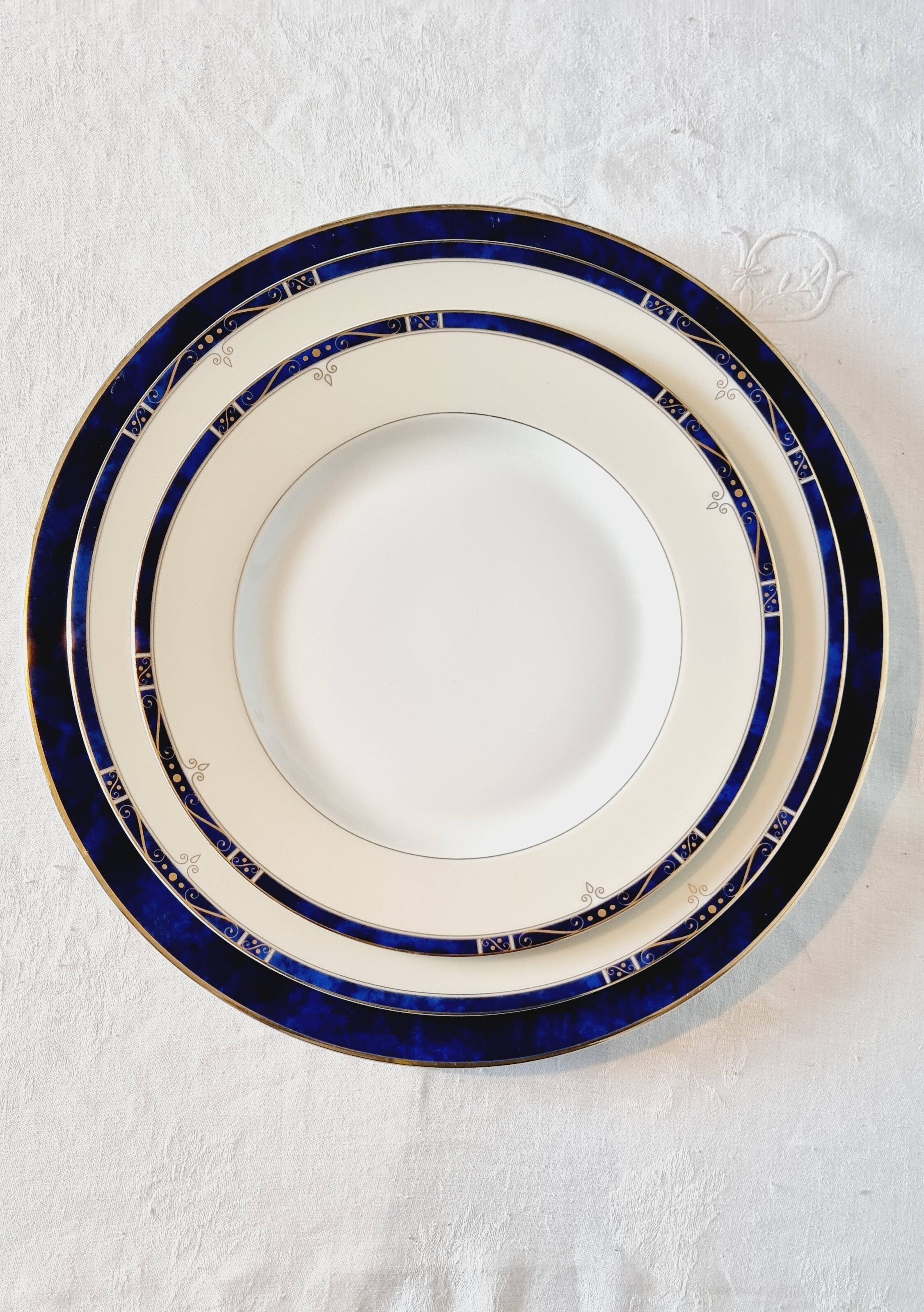 18-piece porcelain dinnerware set from Limoges by Philippe Deshoulières.