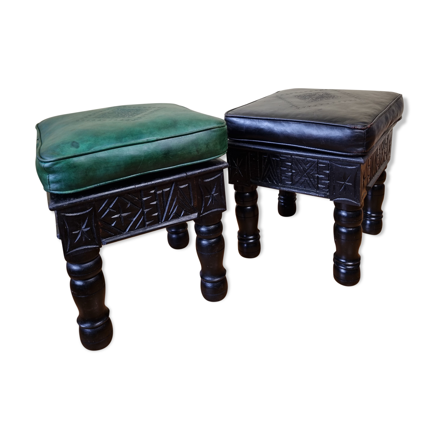 Pair of Moroccan poufs in stamped leather with a carved wooden base, Rabat