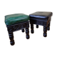 Pair of Moroccan poufs in stamped leather with a carved wooden base, Rabat