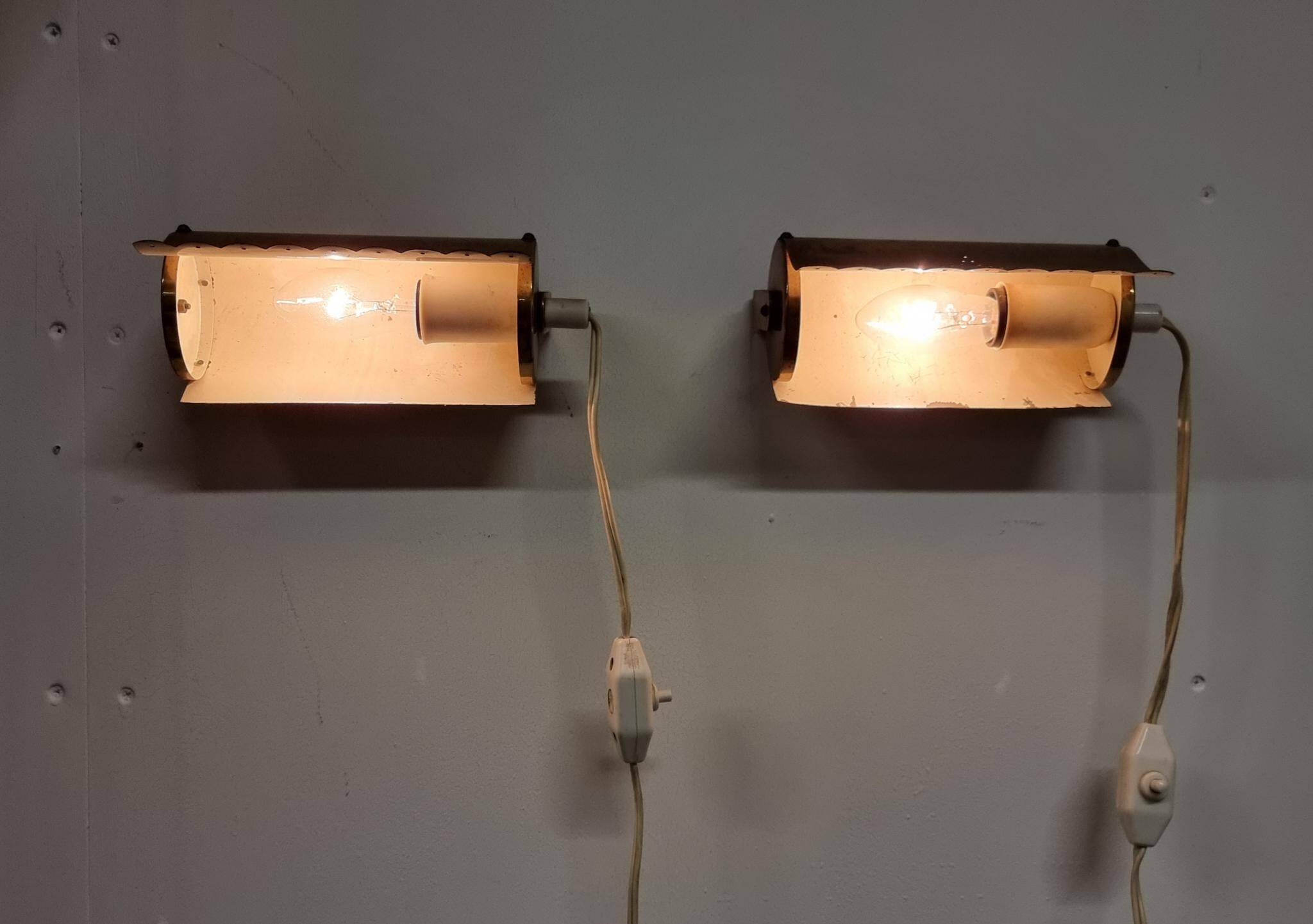 A pair of charming wall sconces/branches in brass with a star pattern, modern Scandinavian style.