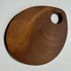 Small circular teak monoxyle cutting board with handle 22 x 13.