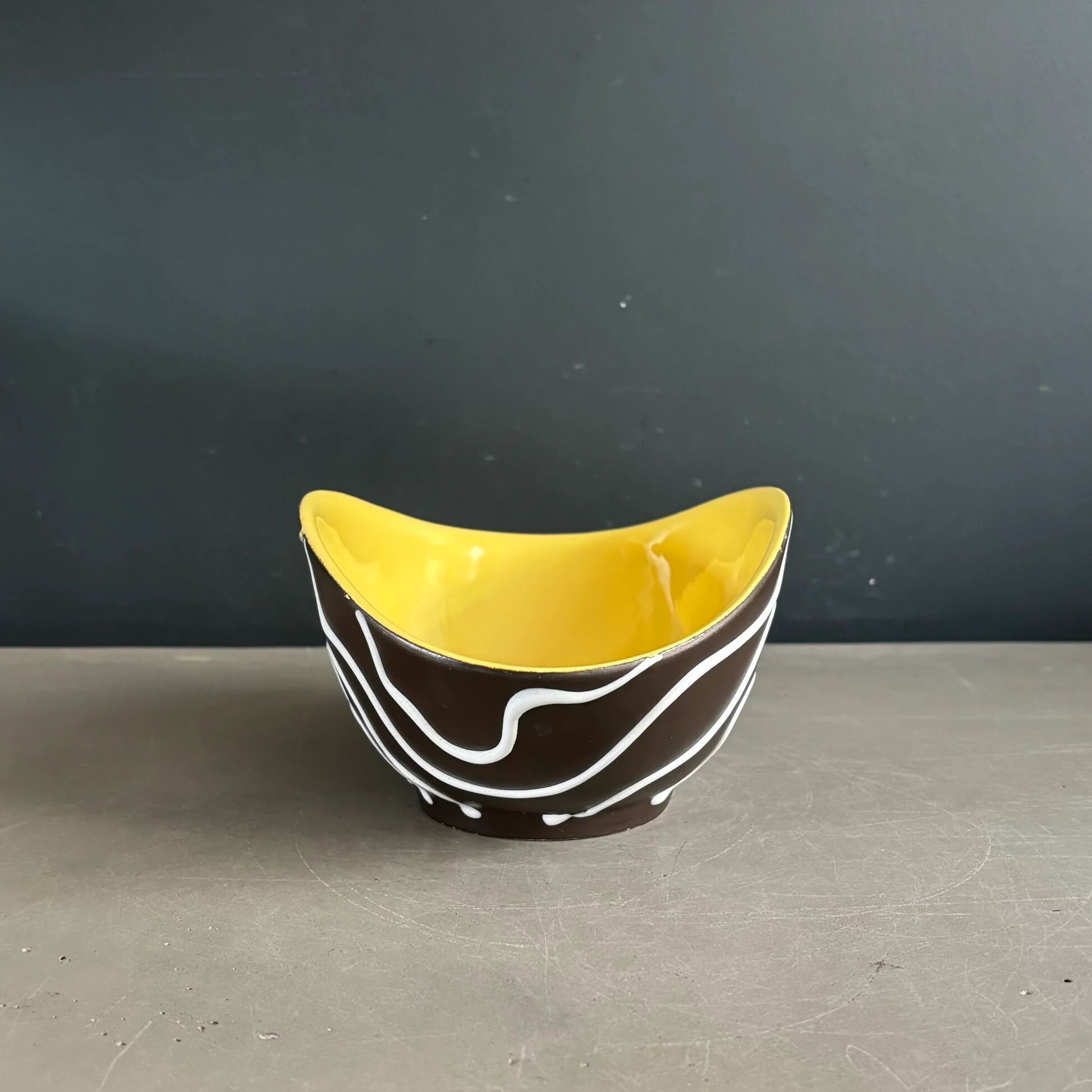 Yellow and black ceramic aperitif bowl, free form, West Germany.
