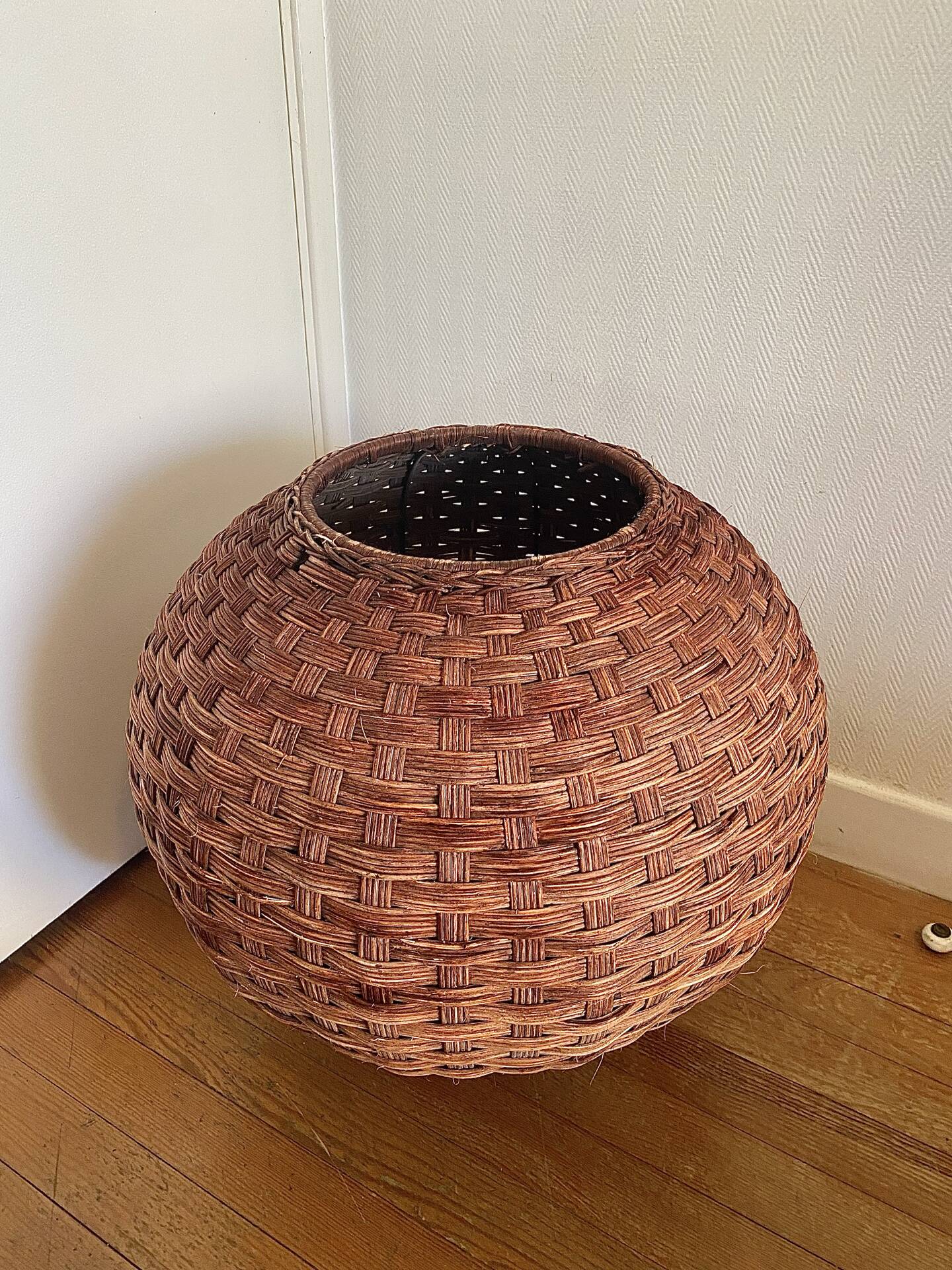 Large vintage lampshade made of hand-woven rattan.
