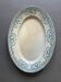 Plat ovale bleu modèle guirlande terre de fer