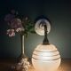 Vintage pink and gold frosted glass globe wall light.