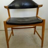Danish armchair in oak and black leather