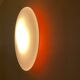 Oval wall lamp Artemide Italy design Patrick Jouin orange and white.