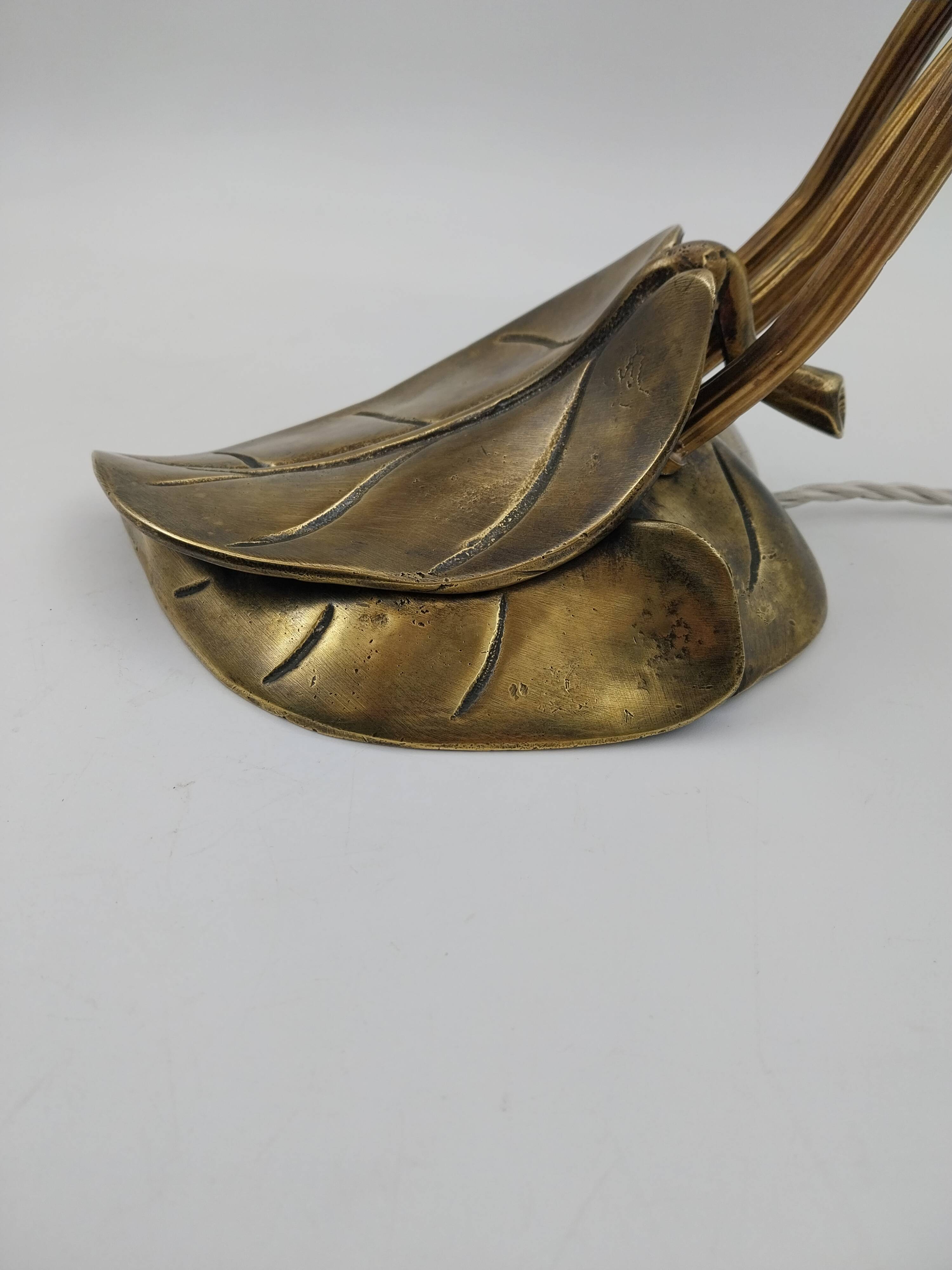 Lamp with brass leaves and glass paste flowers.
