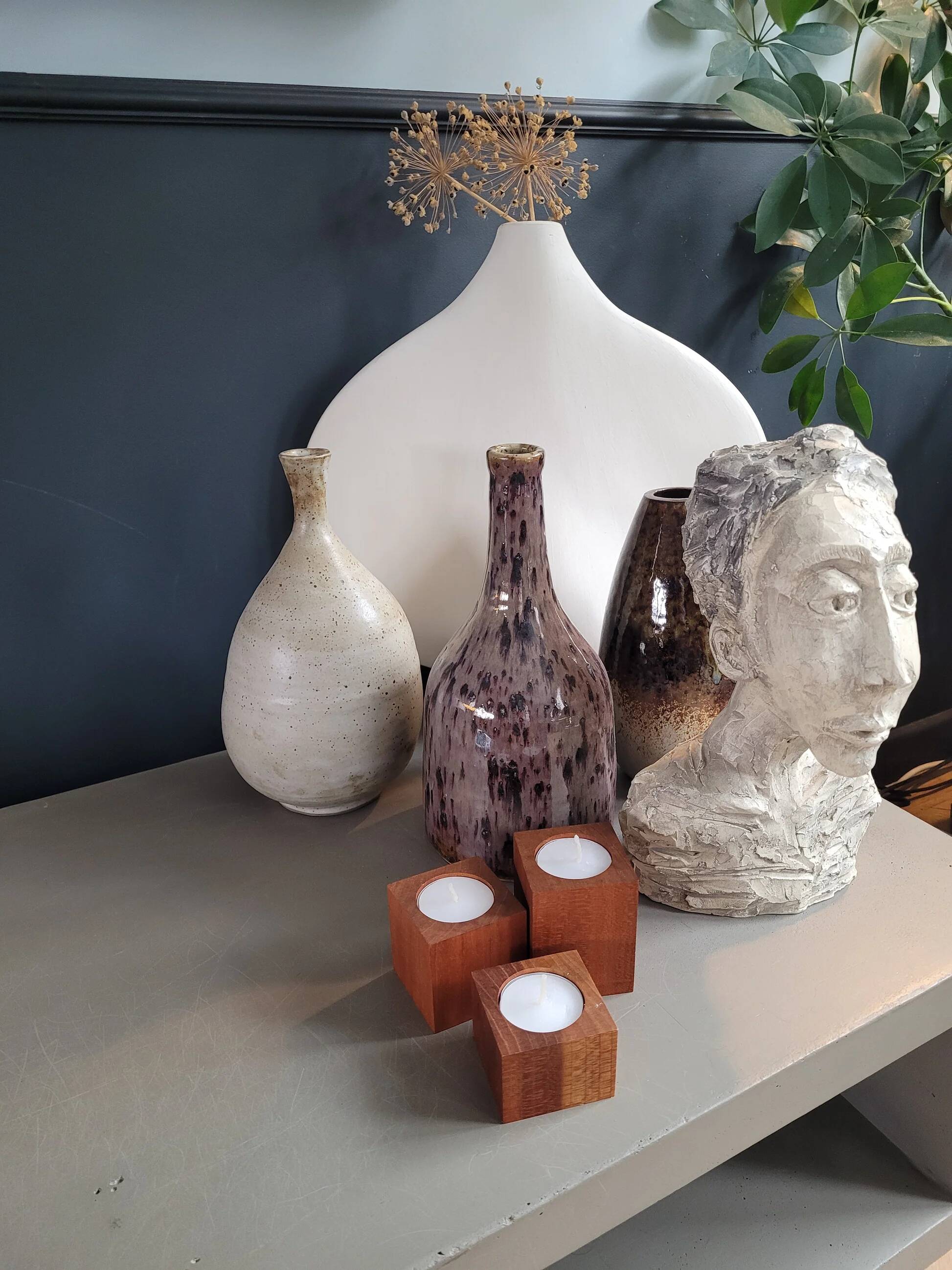 Vintage teak candlestick trio