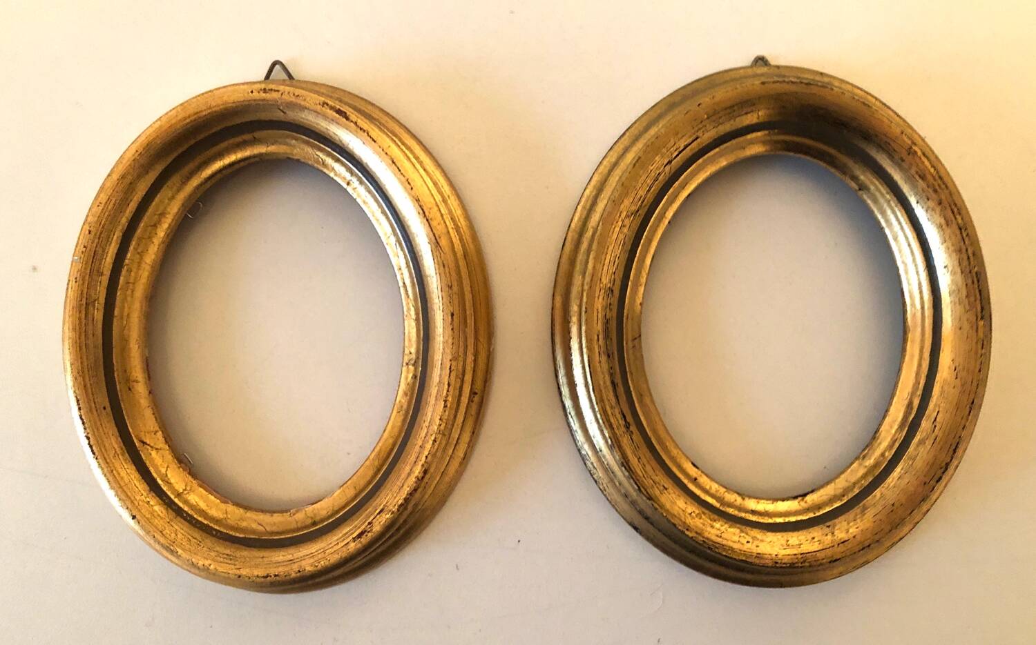 Pair of old oval golden wood frames