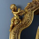 Grand miroir style Louis XV en bois sculpté et doré, XIXe siècle