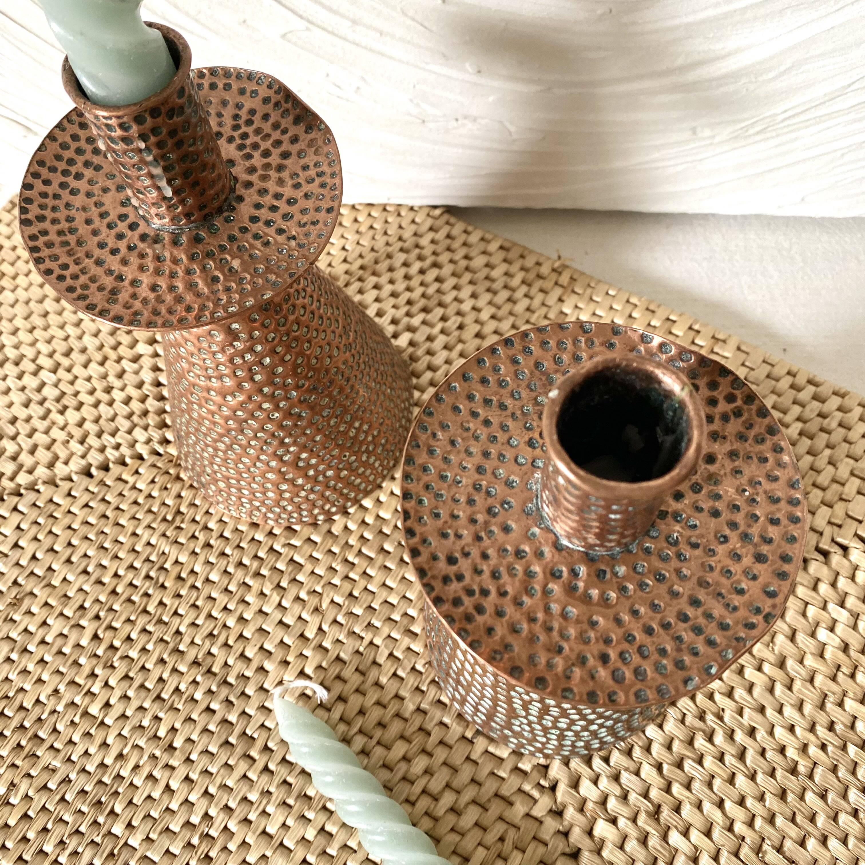 Pair of hammered copper candlesticks from the 1950s