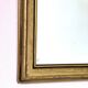 Rectangular gold mirror with bevelled glass.
