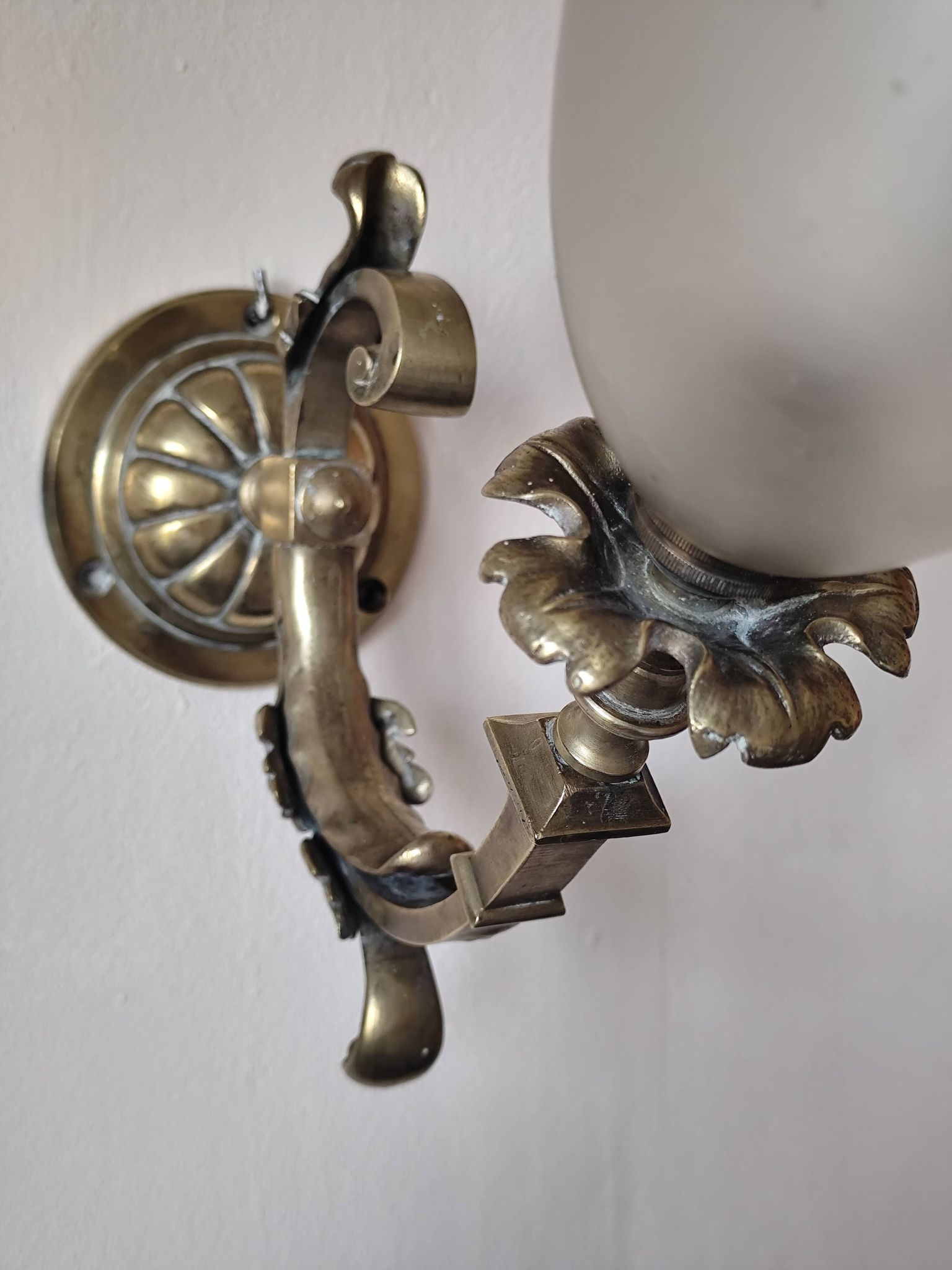 Bronze wall light with opaque glass tulip 1900