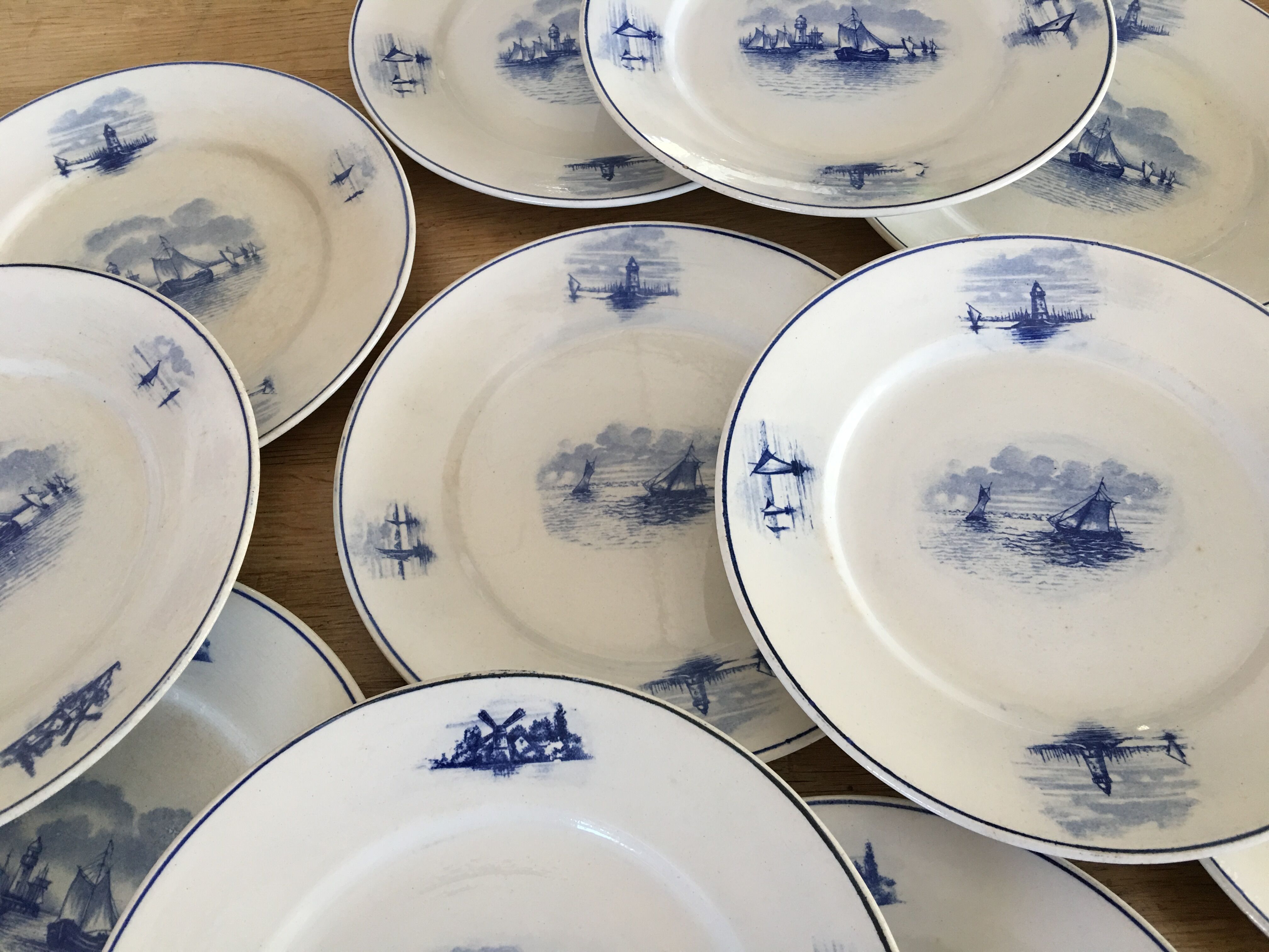 Series of 11 flat plates, Dutch earthenware, early XX