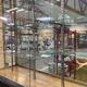 Store window with sliding doors in matte black patinated oak - 30s