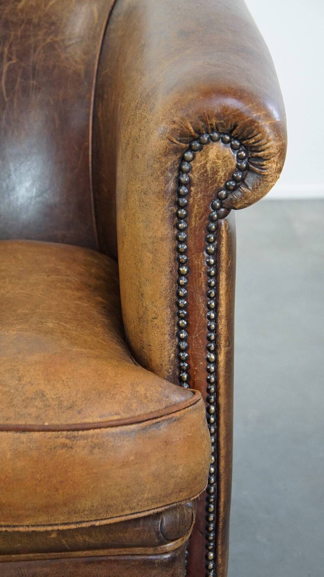 Characterful sheepskin leather club armchair with a luxurious, rustic appearance