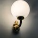 Pair of wall sconces with carp fish, brass and opaline globe.