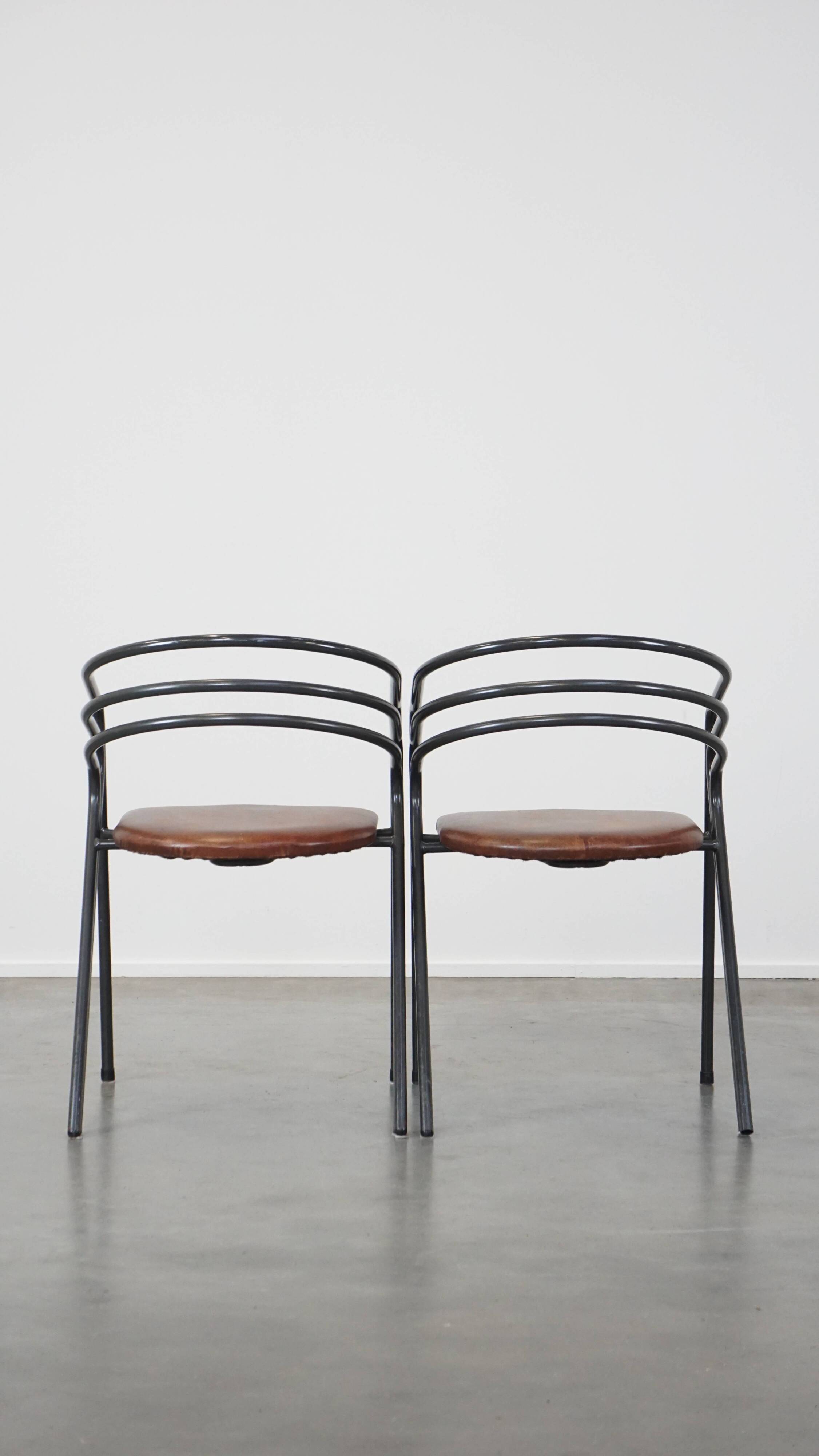 Set of 4 1970s design dining chairs with leather seats and metal frame