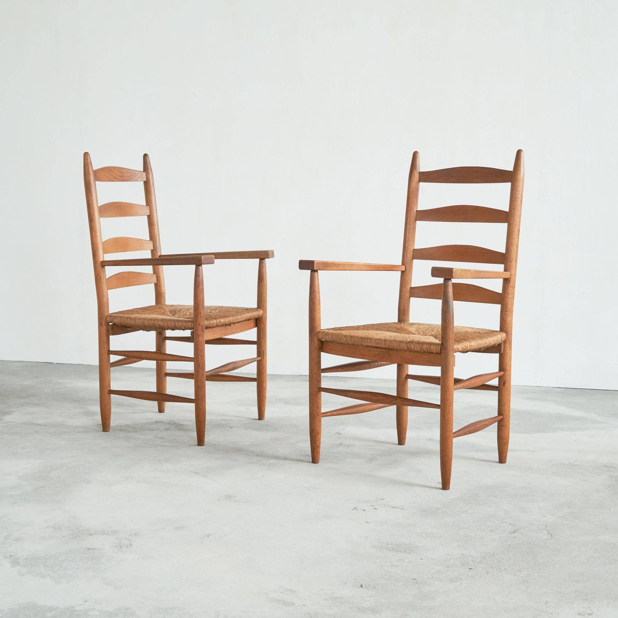 Set of 2 oak and wicker armchairs, mid-20th century.