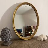 Old golden oval mirror