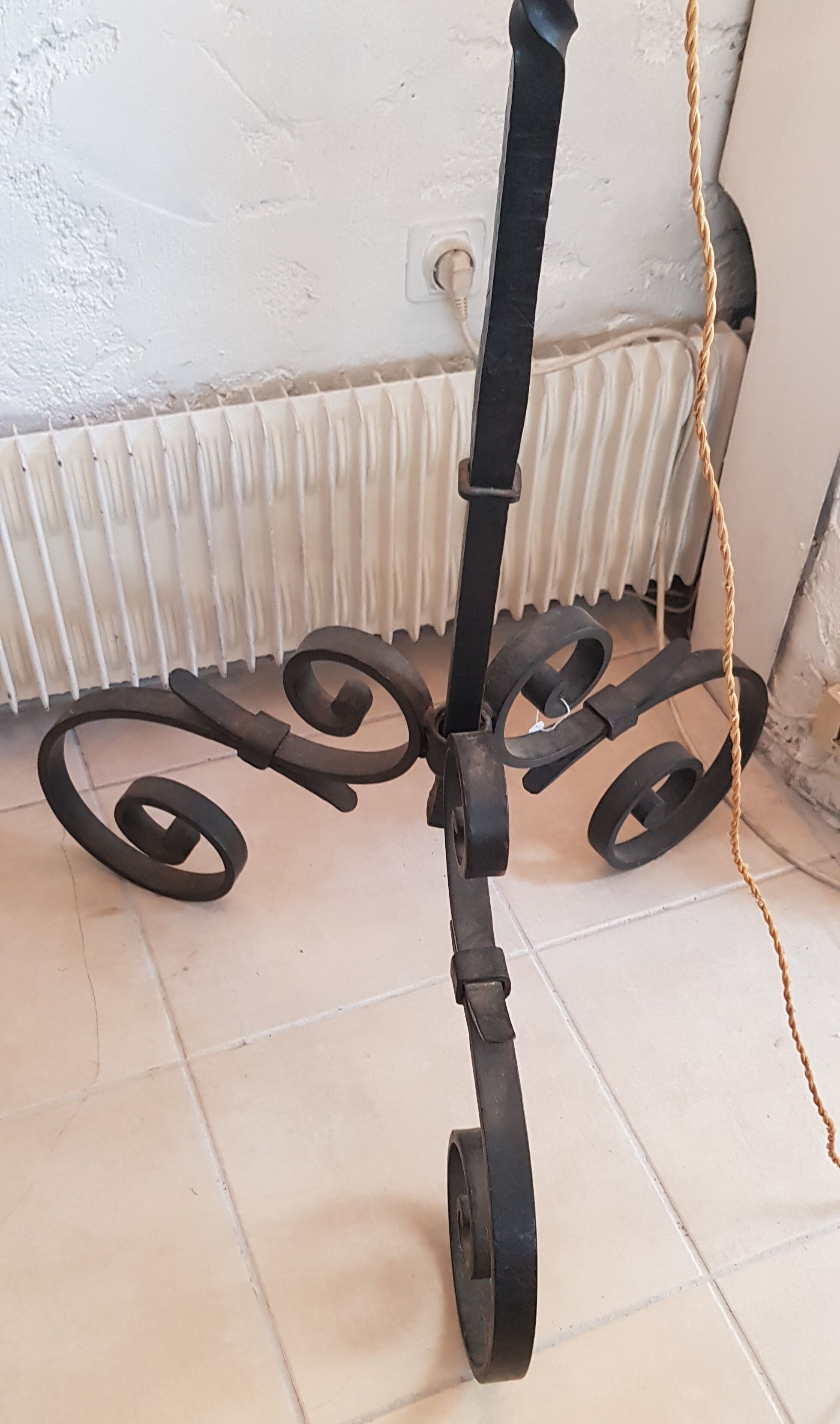 Old wrought iron tripod lamppost